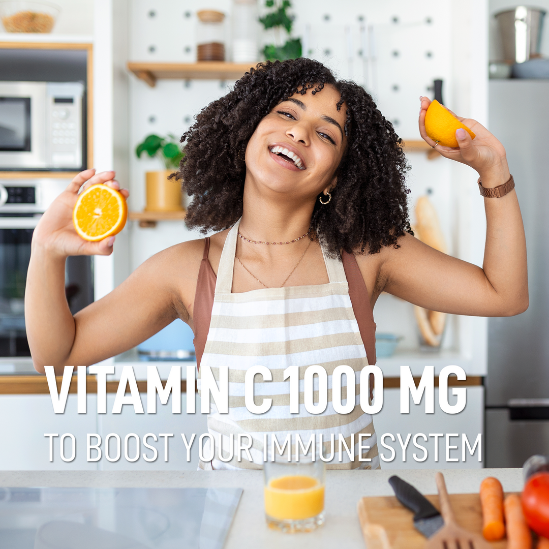 Vitamin C 1000 mg to boost your immune system — happy lifestyle in the kitchen with fresh oranges
